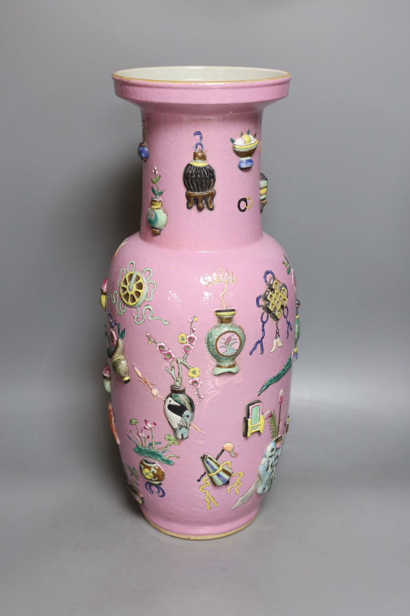 A large Chinese pink ground ‘Hundred Antiques’ vase, 49 cms high.